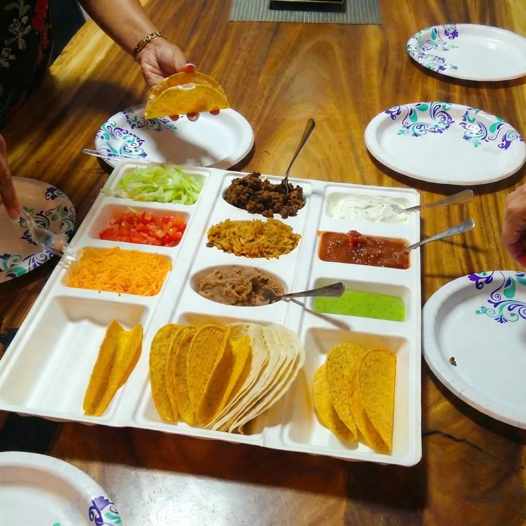 Tray filled with tacos and sides